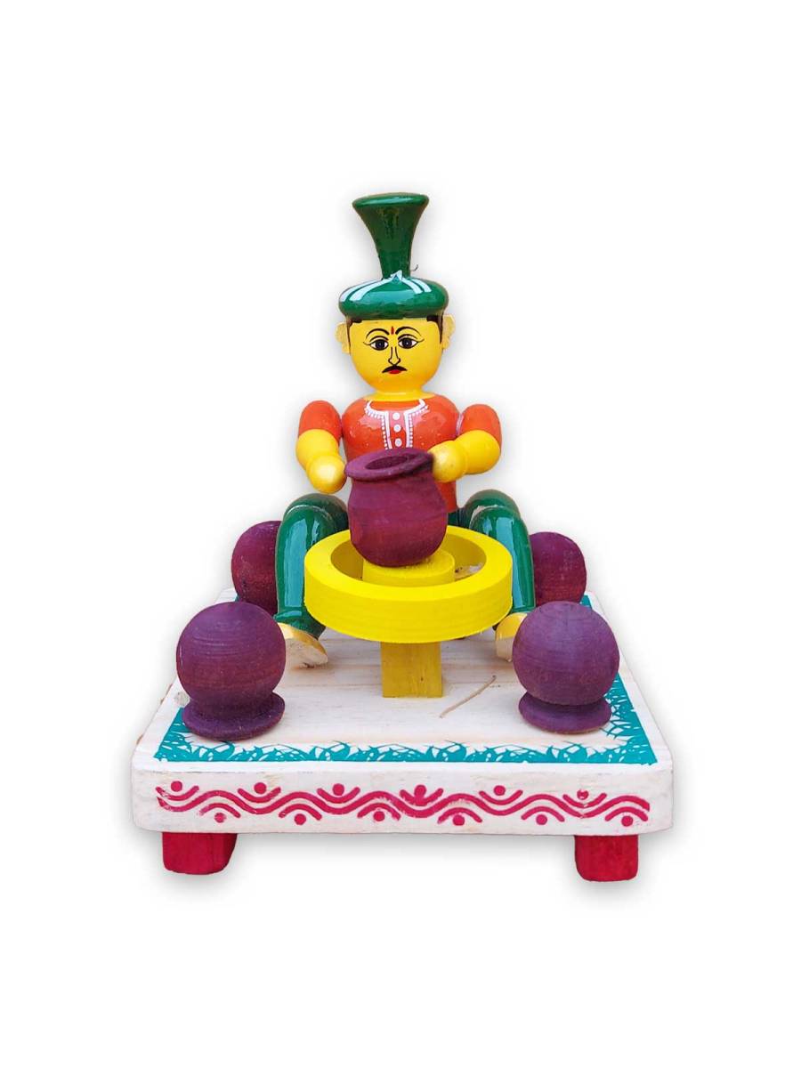 Wooden Village Man Making Pot - Etikoppaka Dolls
Wooden Village Man Making Pot - Etikoppaka Dolls