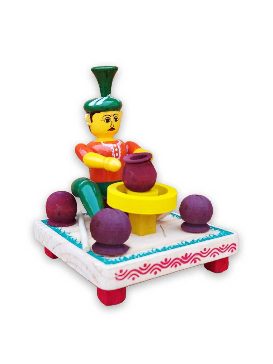 Wooden Village Man Making Pot - Etikoppaka Dolls
Wooden Village Man Making Pot - Etikoppaka Dolls