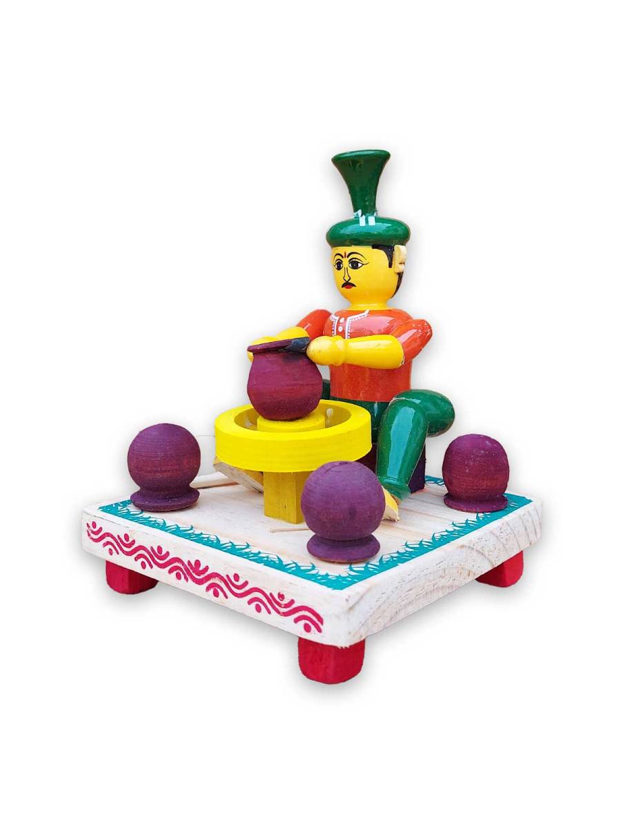 Wooden Village Man Making Pot - Etikoppaka Dolls
Wooden Village Man Making Pot - Etikoppaka Dolls